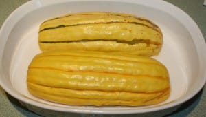 Delicata squash with a bit of water ready for the microwave.
