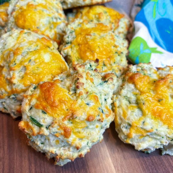 cheese and spinach biscuit piled on board