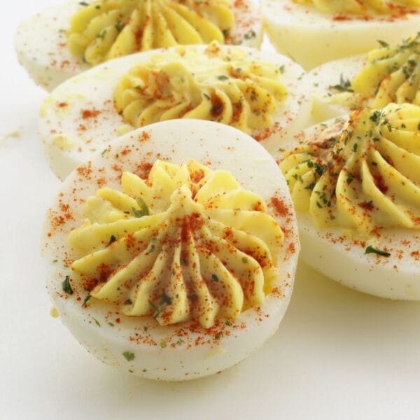 sprinkle of parsley and paprika on piped deviled egg