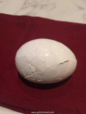 well cracked hard boiled egg