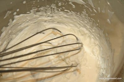 Gently whisk in fresh cream to save over-whipped cream