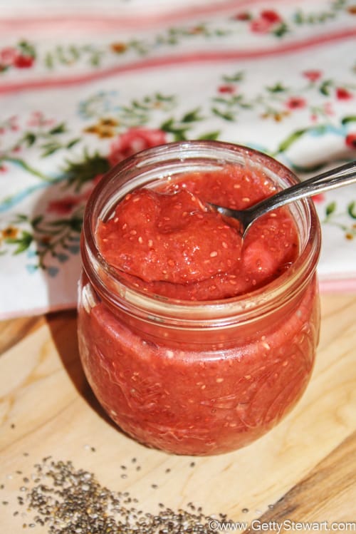strawberry rhubarb chia seed jam in jar with spoon
