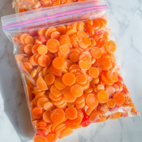 blanched carrot coins in freezer bag