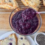 blueberry strawberry chia seed jam in glass dish with spoon