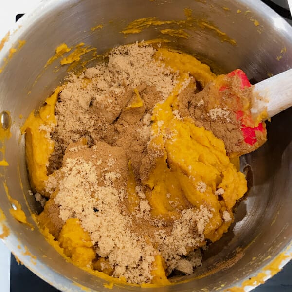 mixing spices and squash