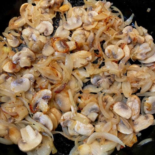 sauteed mushrooms and onion in pan