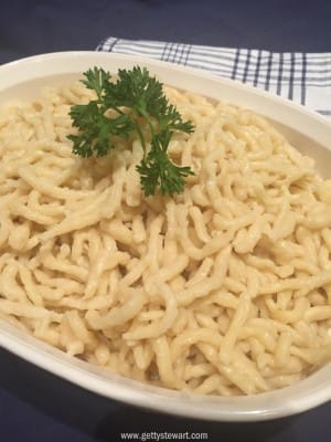 spaetzle with a sprig of parsley