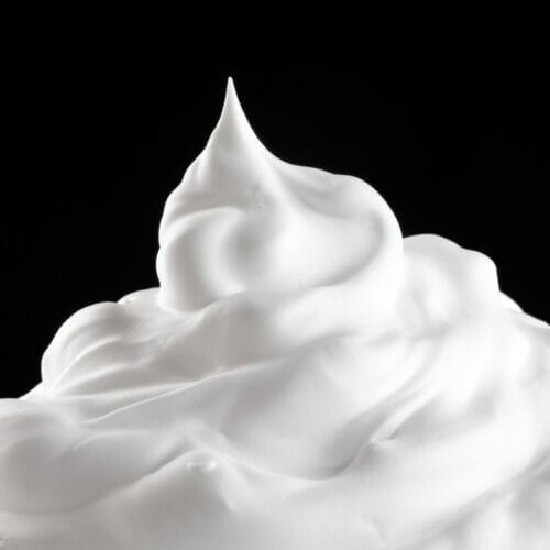 bowl of whipped cream with stiff point