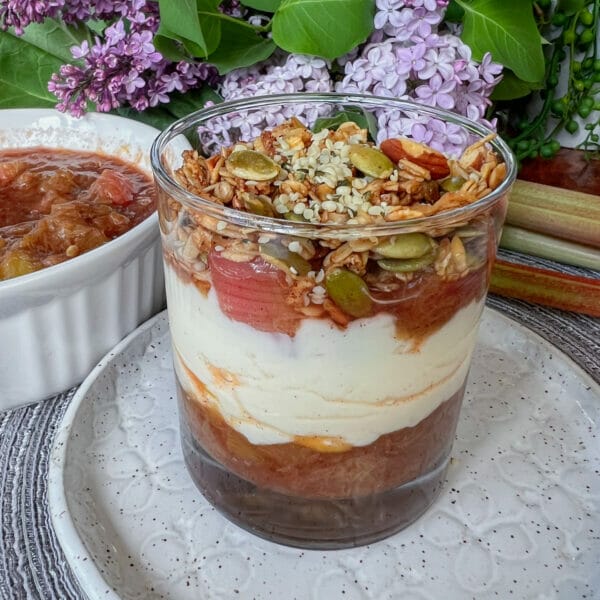 stewed rhubarb layered with yogurt and granola in glass