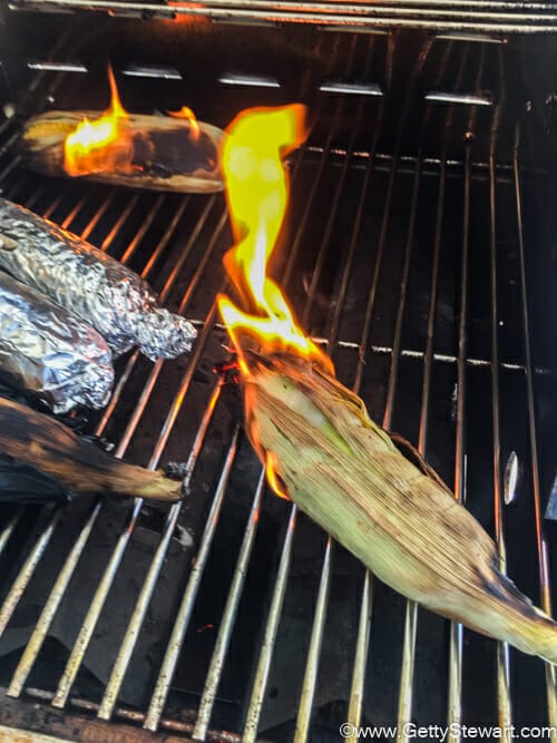 corn on fire on grill