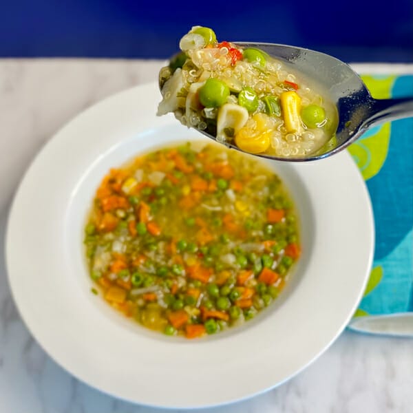 quinoa lentil soup on spoon