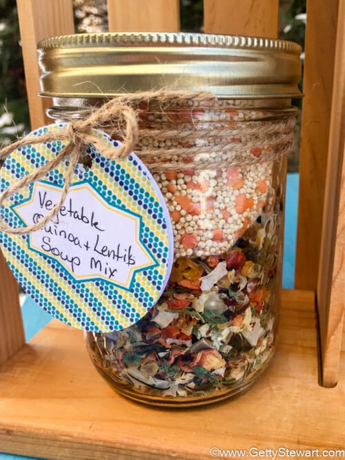vegetable quinoa soup mix in a jar with a decorative gift label