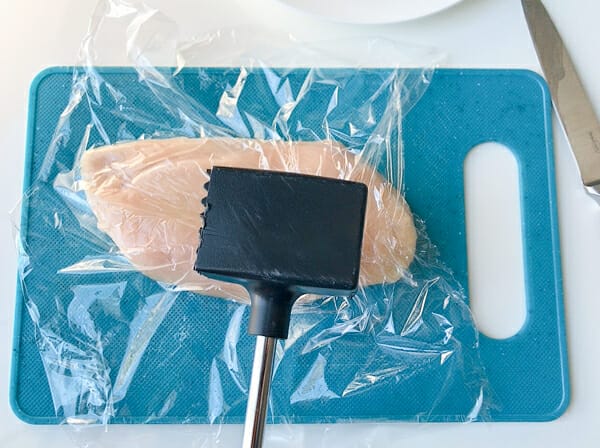 side of meat mallet to even out chicken breast