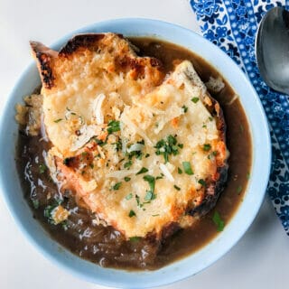 bowl of french onion soup with cheese bread