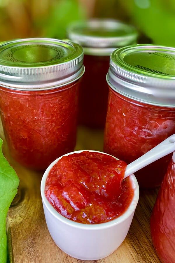 jars of jam with some in dish