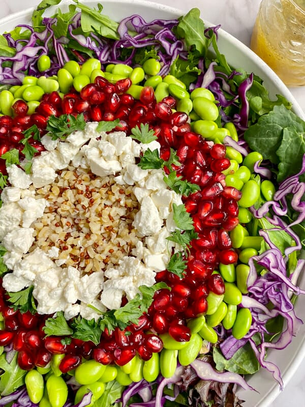 close up of colourful pomegranate whole grain salad