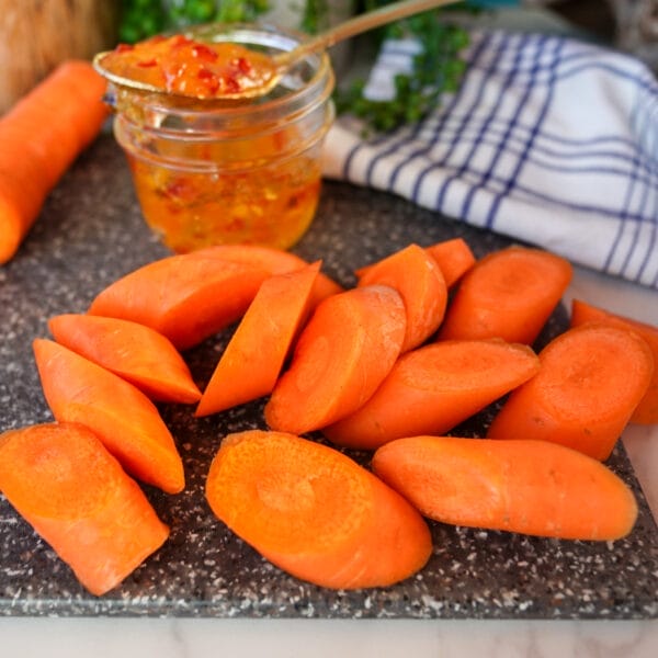 diagonal cut carrots on cutting board
