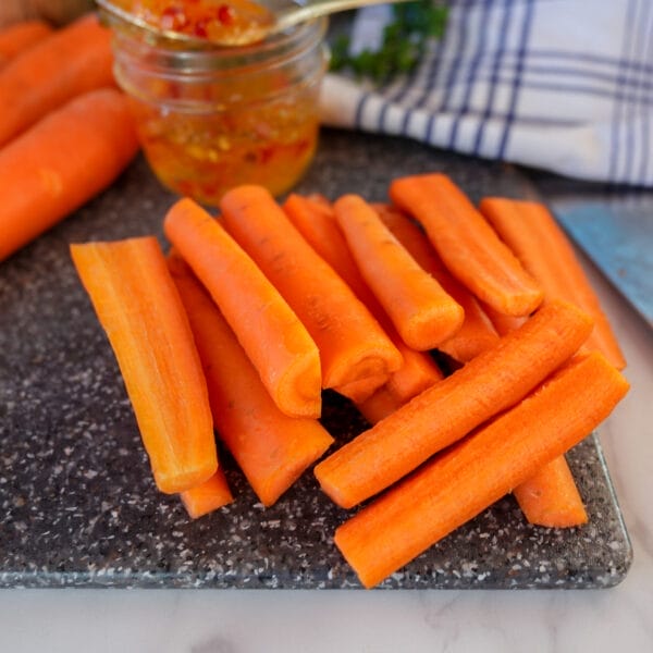 spear cut carrots on cutting board