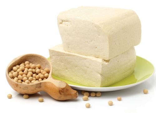 block of firm tofu with soybeans