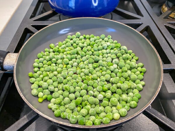 frozen peas in the saute pan