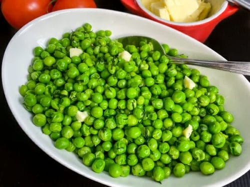 peas with dill and butter in bowl