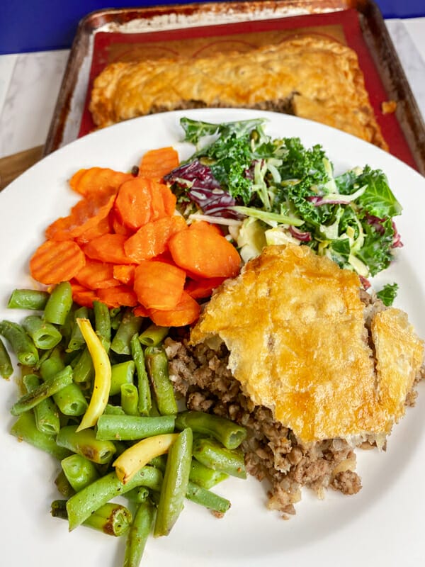 tourtiere on the plate with veggies