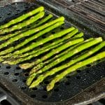 green asparagus on grill pan on bbq