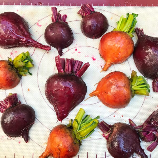multi color beets on baking sheet