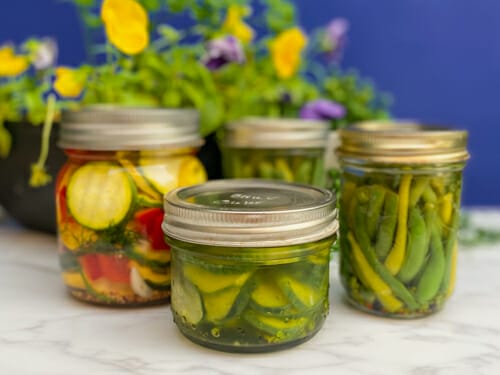 three kinds of pickled veggies in jars