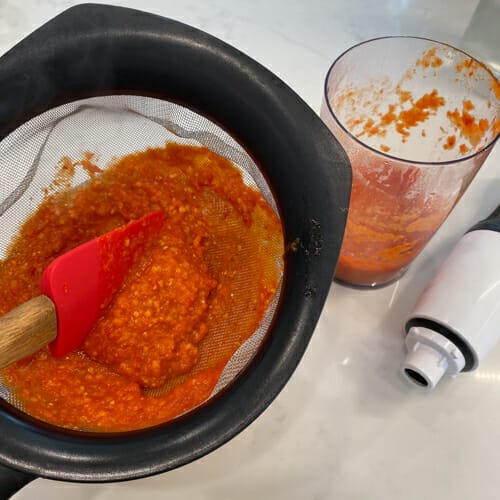 straining hot sauce