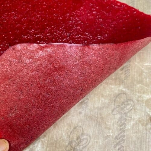 Fruit leather curling up and off the drying sheet. Leather lifts off cleanly when perfectly dry.