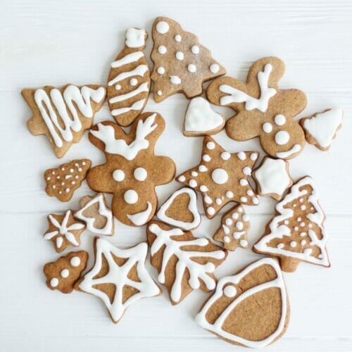 white icing decorated chocolate gingerbread cookies
