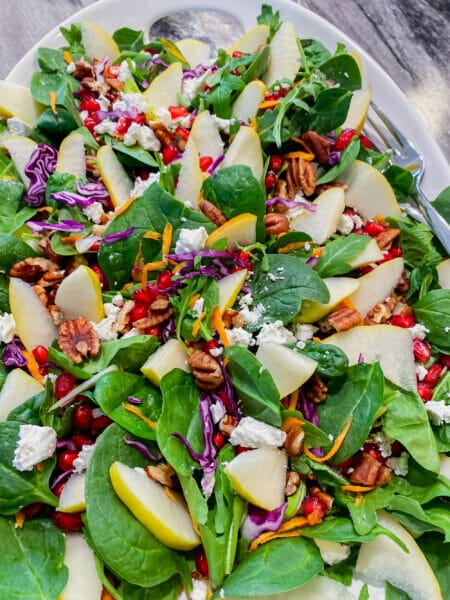 pear and pomegranate salad on a platter