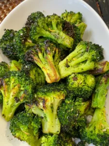 roasted broccoli on white plate