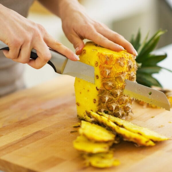 peeling fresh pineapple