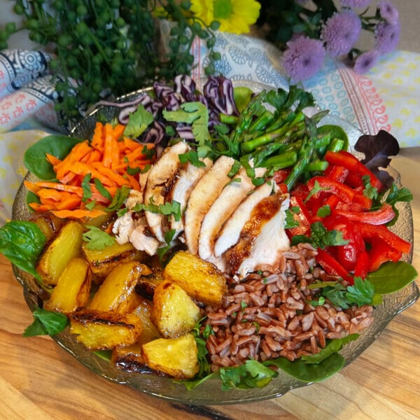 grilled chicken and grilled pineapple in grain bowl