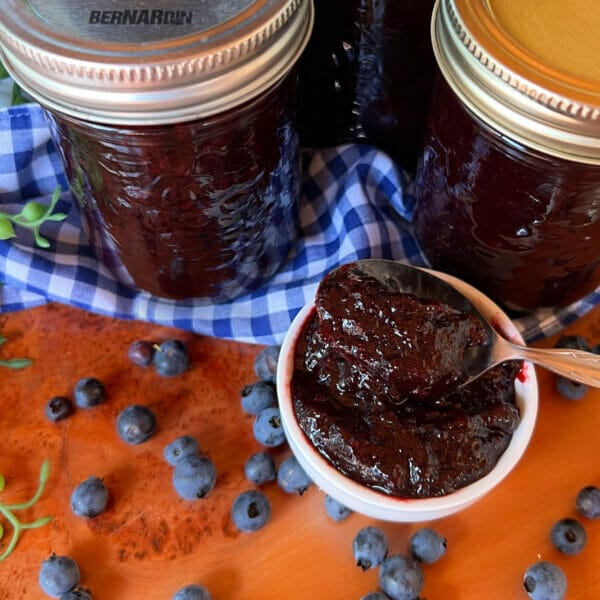 blueberry jam jars and jam on spoon