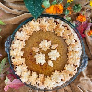 pumpkin pie decorated with pie crust cut outs