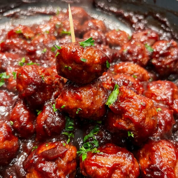cranberry molasses BBQ sauce appetizer meatballs with toothpick
