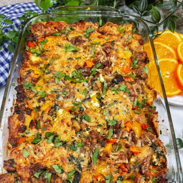 a fully baked sausage breakfast strata in a glass baking dish