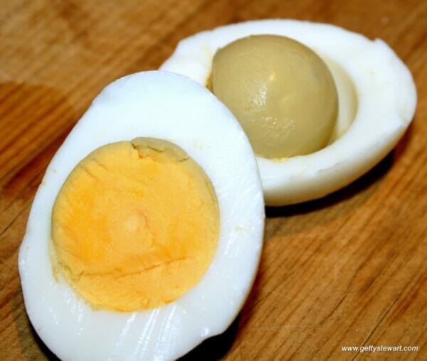 cooked egg, cut in half with greenish yolk inside