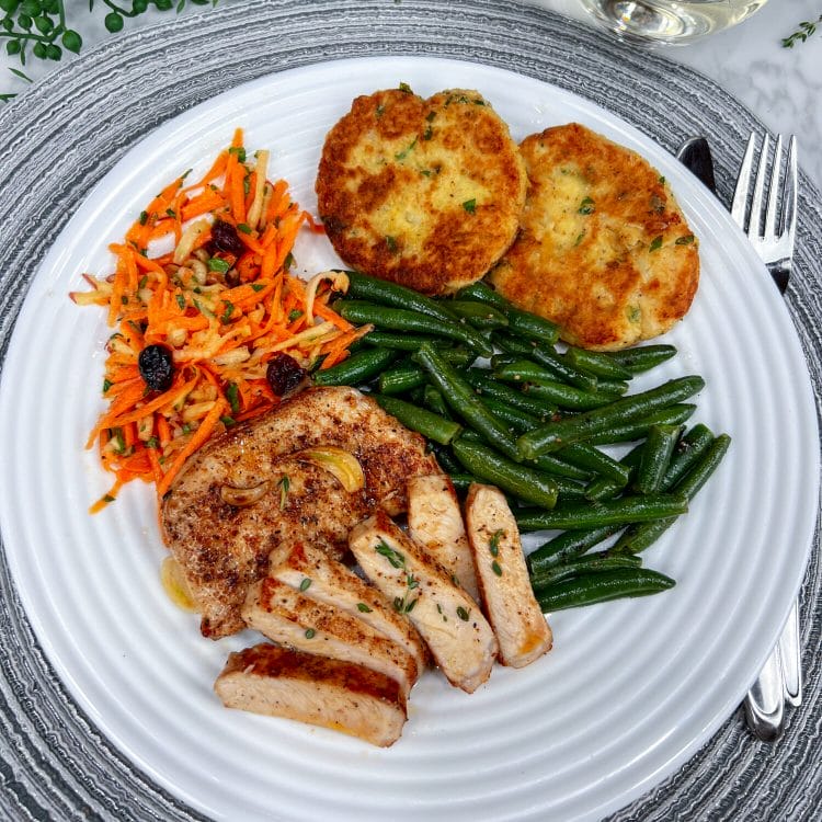 pork chop with three side dishes on plate