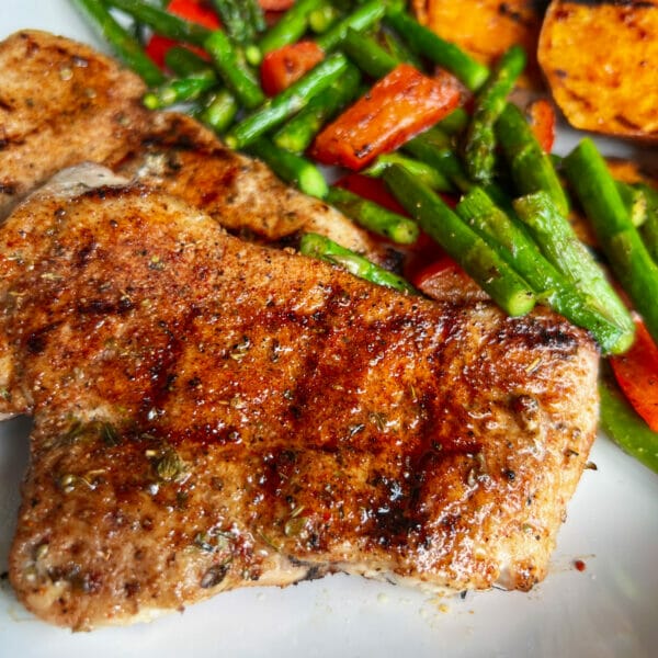grilled spice rubbed pork chop with asparagus