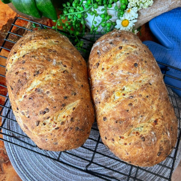 two loves of cottage cheese dill bread on cooling rack
