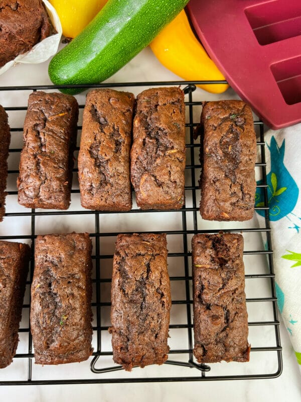 mini loaves of chocolate zucchini loaf on cooling rack
