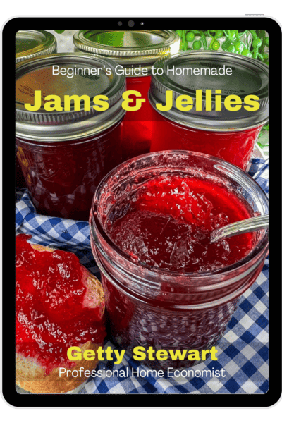cover of jam book with text and jar of red jam