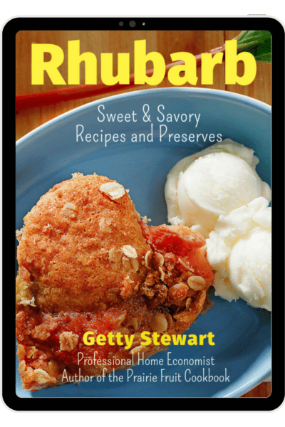 cover of rhubarb recipe book featuring text and rhubarb cake