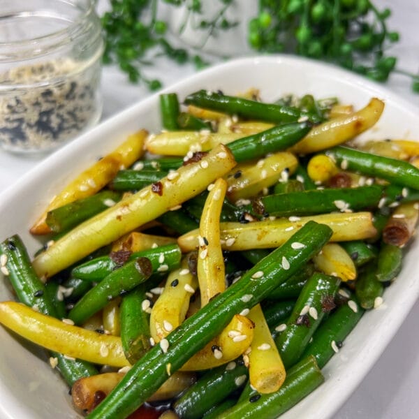 frozen green beans with sesame seeds and a soy sauce drizzle