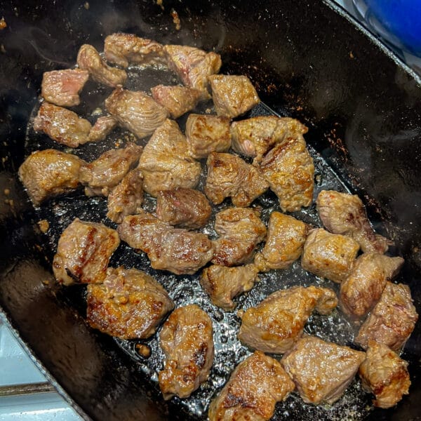 browned beef cubes in pot