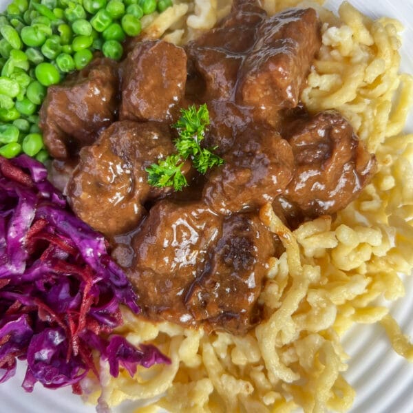 goulash on noodles with peas